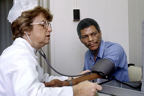 Nurse measuring a patient's blood pressure