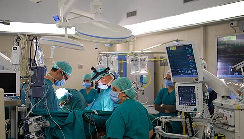 Surgical team operating in a hospital operating room